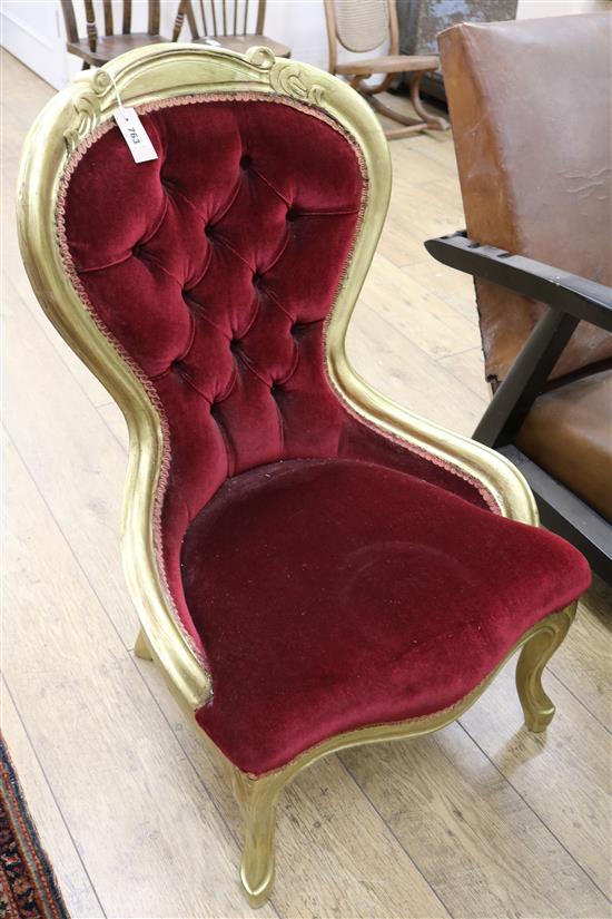 A gilt framed nursing chair